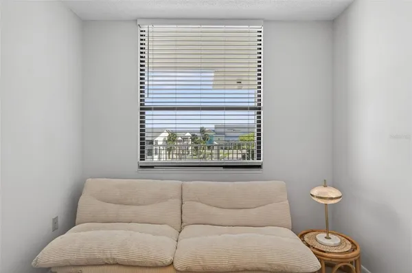 a bathroom with a toilet and a window