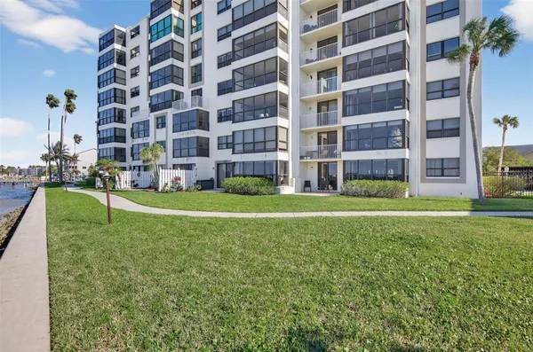 a view of a building with a yard