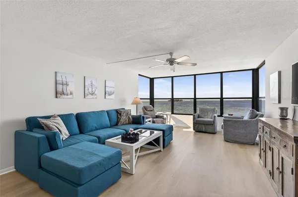 a living room with furniture and a large window