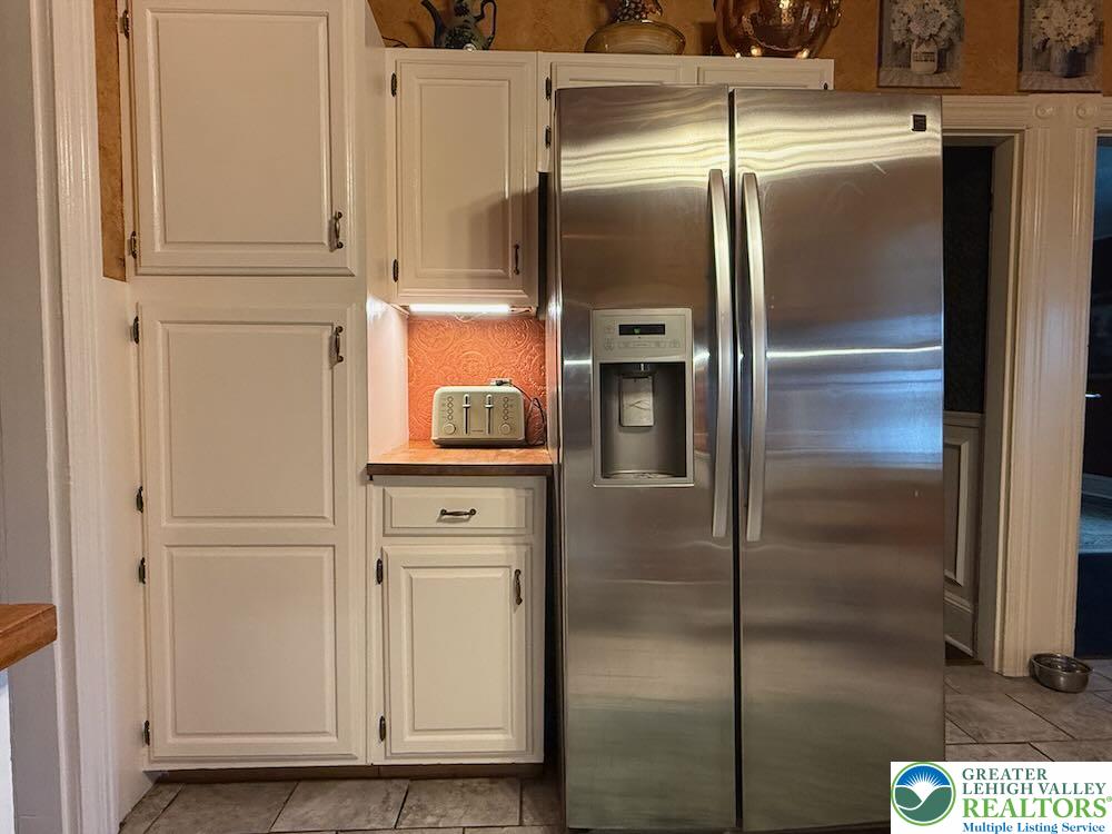 6423 Front Street Bangor, PA 18013 - Photo 17 of 60 a kitchen with metallic refrigerator freezer and a dishwasher