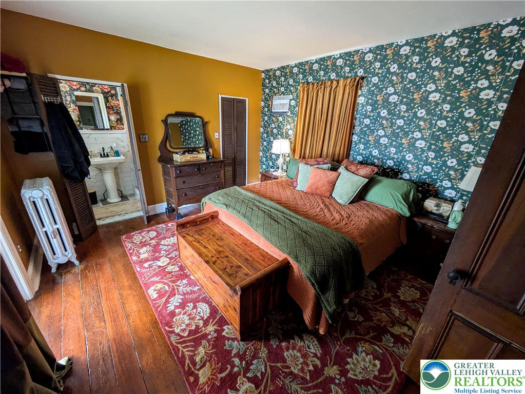 6423 Front Street Bangor, PA 18013 - Photo 33 of 60 a bedroom with a bed and wooden floor
