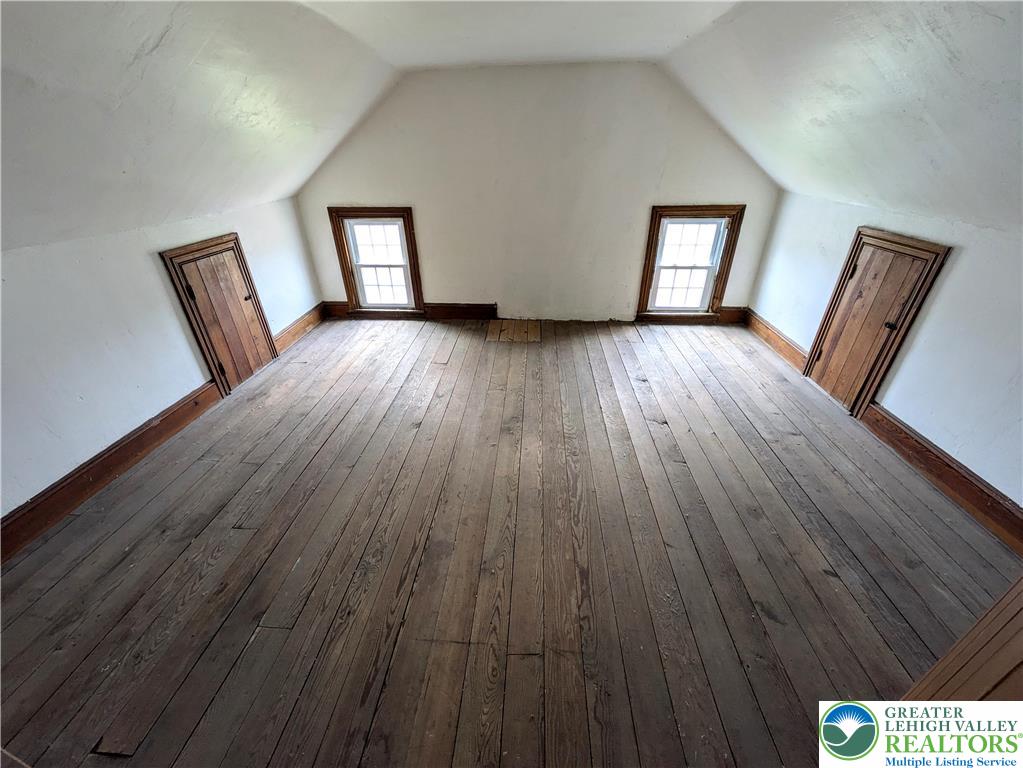 6423 Front Street Bangor, PA 18013 - Photo 43 of 60 a view of an empty room with wooden floor and a window