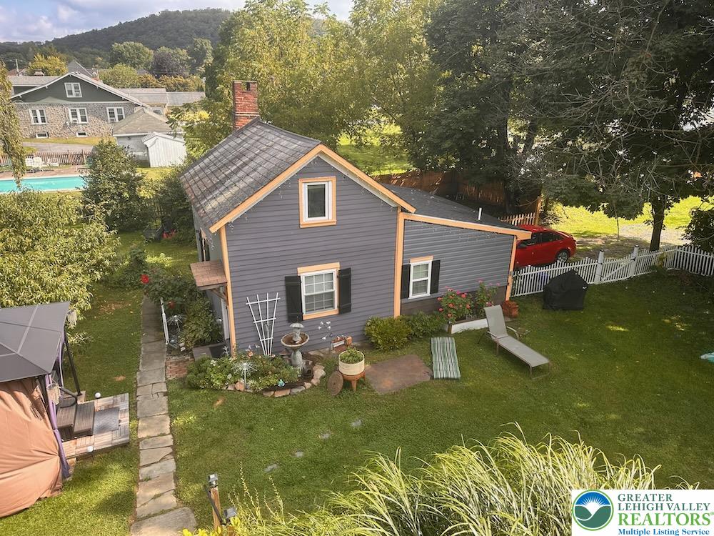 6423 Front Street Bangor, PA 18013 - Photo 47 of 60 a aerial view of a house with swimming pool and a yard