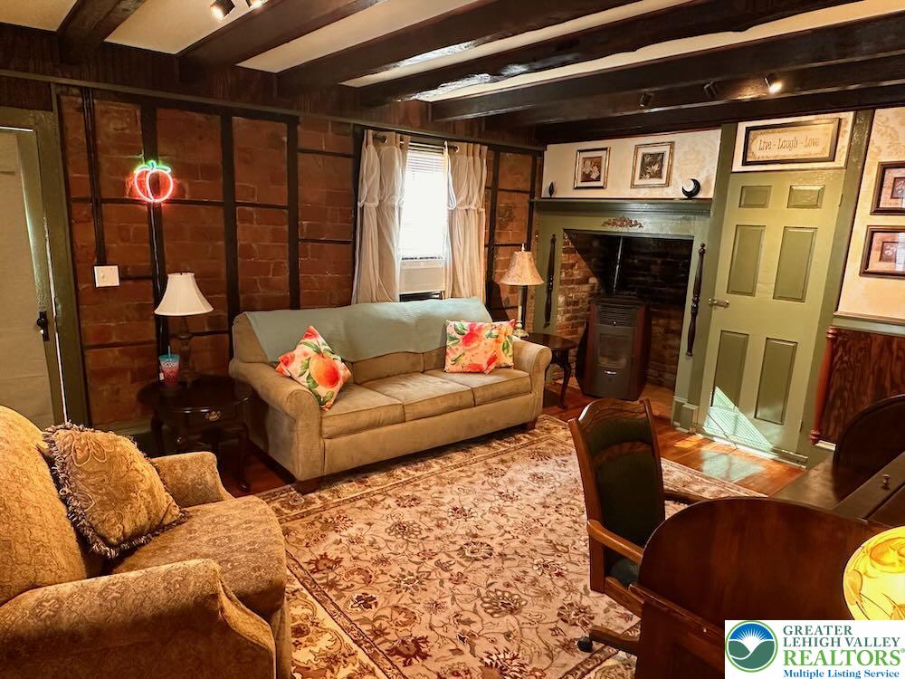 6423 Front Street Bangor, PA 18013 - Photo 52 of 60 a living room with furniture and a fireplace