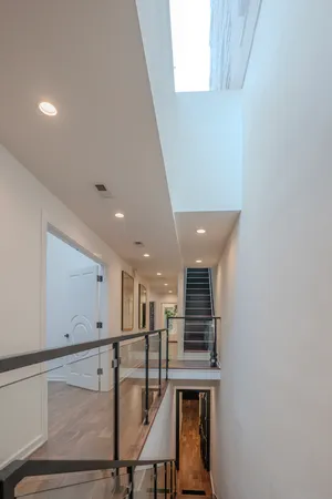 a view of a hallway with seating area