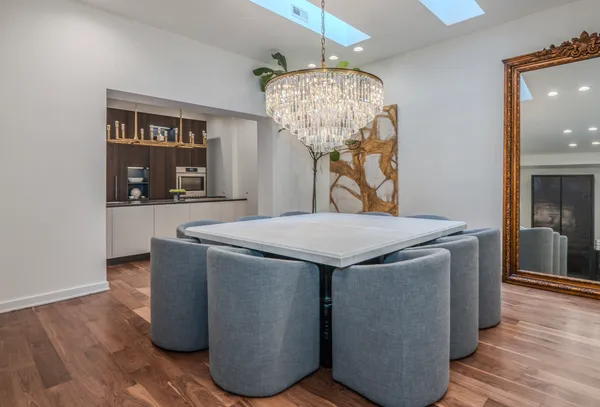 a kitchen with stainless steel appliances a sink and a refrigerator