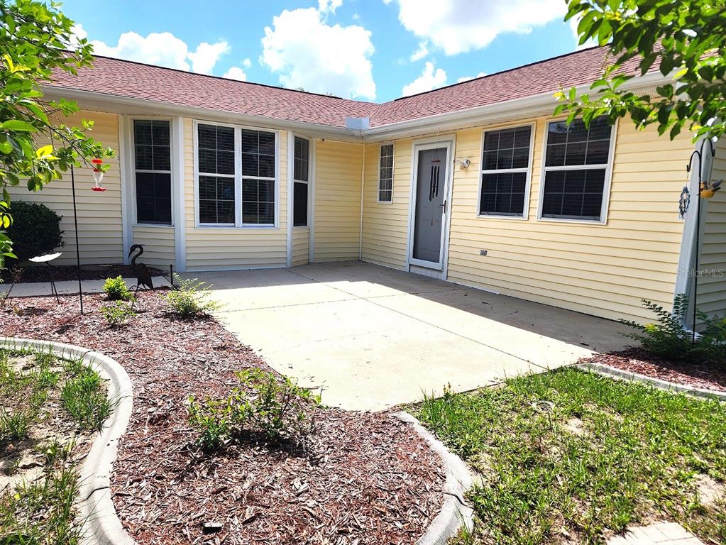 11660 Southwest 89th Terrace Ocala, FL 34481 - Photo 15 of 16 a front view of a house with garden