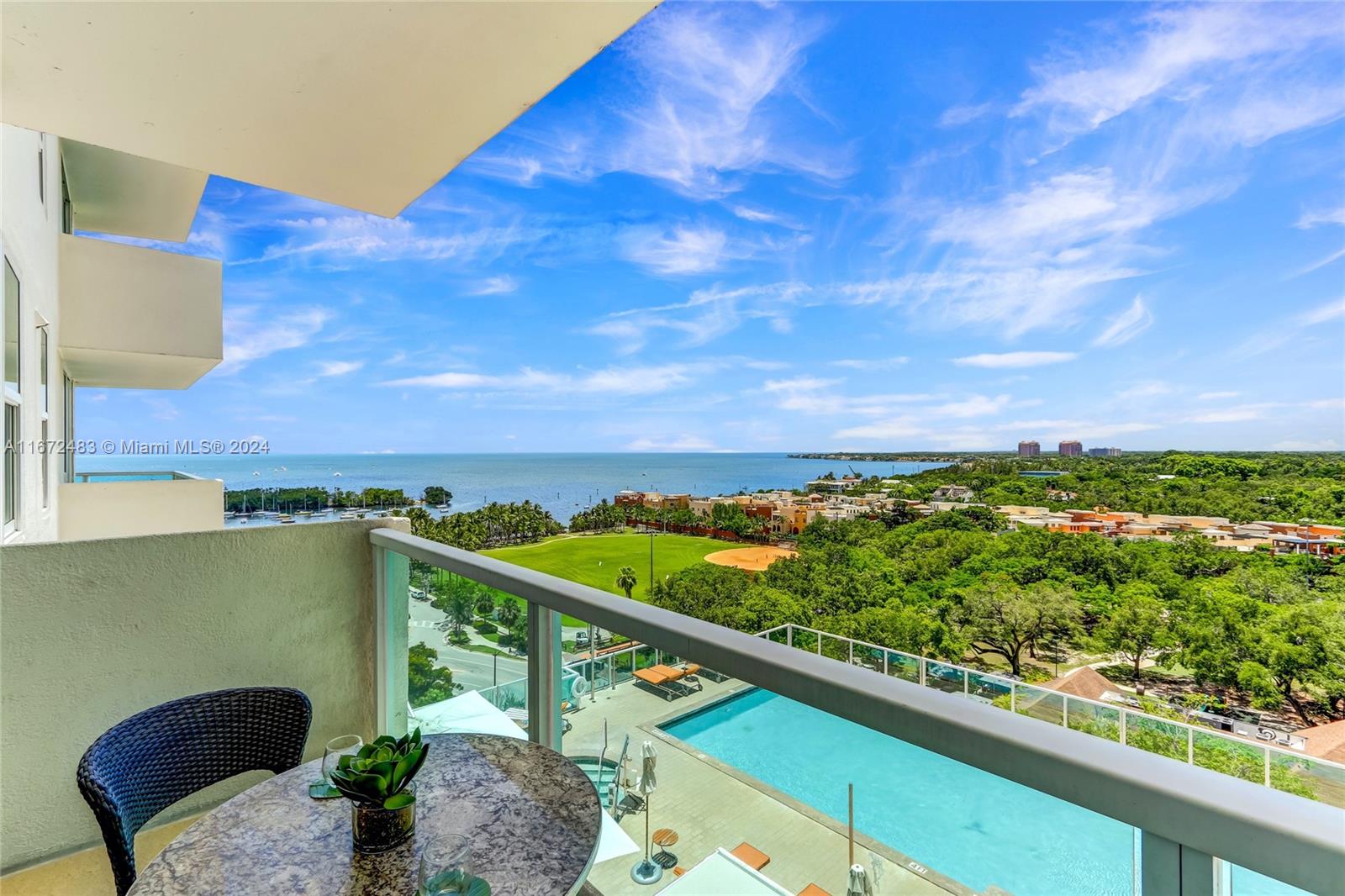 2889 McFarlane Road, Unit 904 Coconut Grove, FL 33133 - Photo 2 of 8 a view of a balcony with an outdoor seating