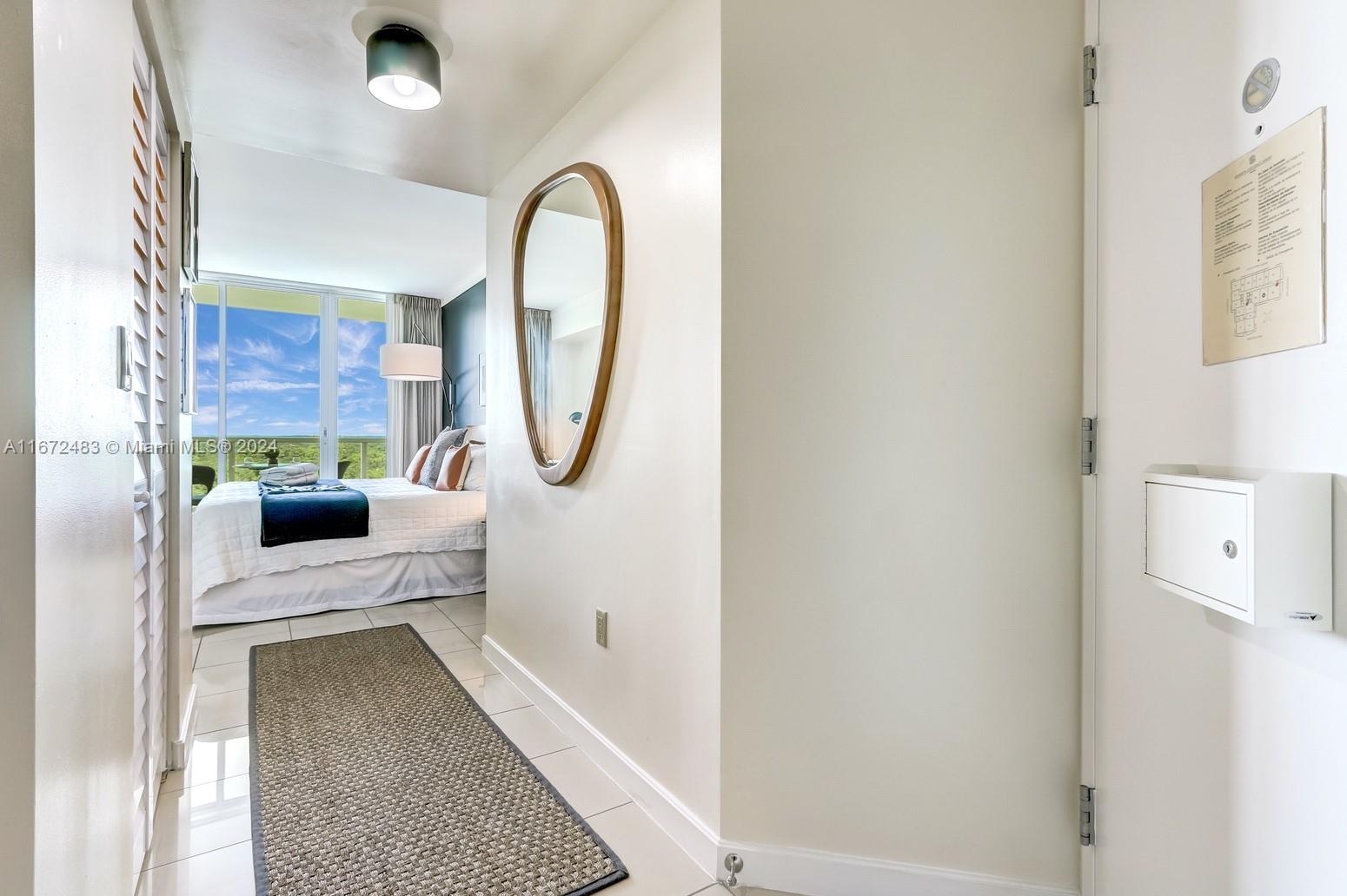 2889 McFarlane Road, Unit 904 Coconut Grove, FL 33133 - Photo 5 of 8 a en suite bathroom with a sink and a mirror