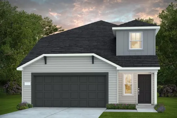 a front view of a house with garage