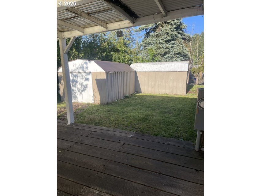 5660 Daisy Street, Unit 31 Springfield, OR 97478 - Photo 8 of 44 a view of backyard with wooden fence