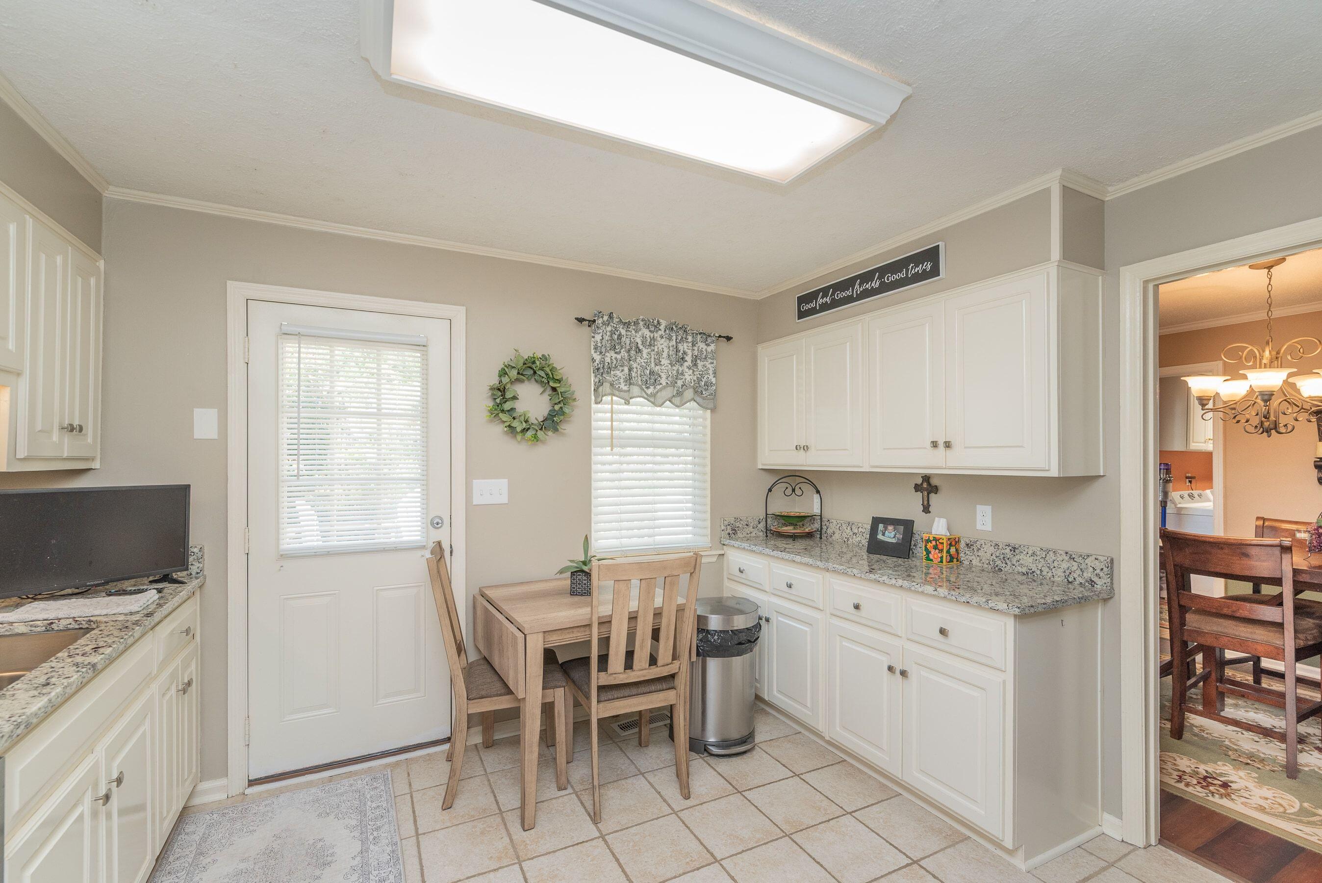 1117 Ridgemont Drive Aiken, SC 29803 - Photo 14 of 49 a kitchen with a sink cabinets and window