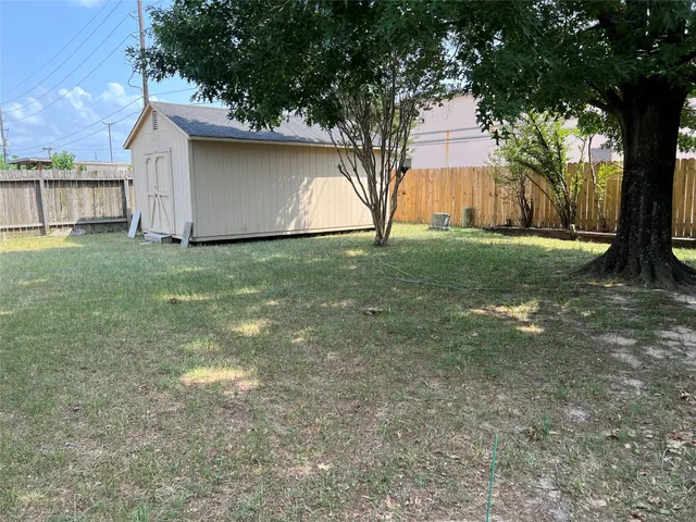 a backyard of a house with lots of green space