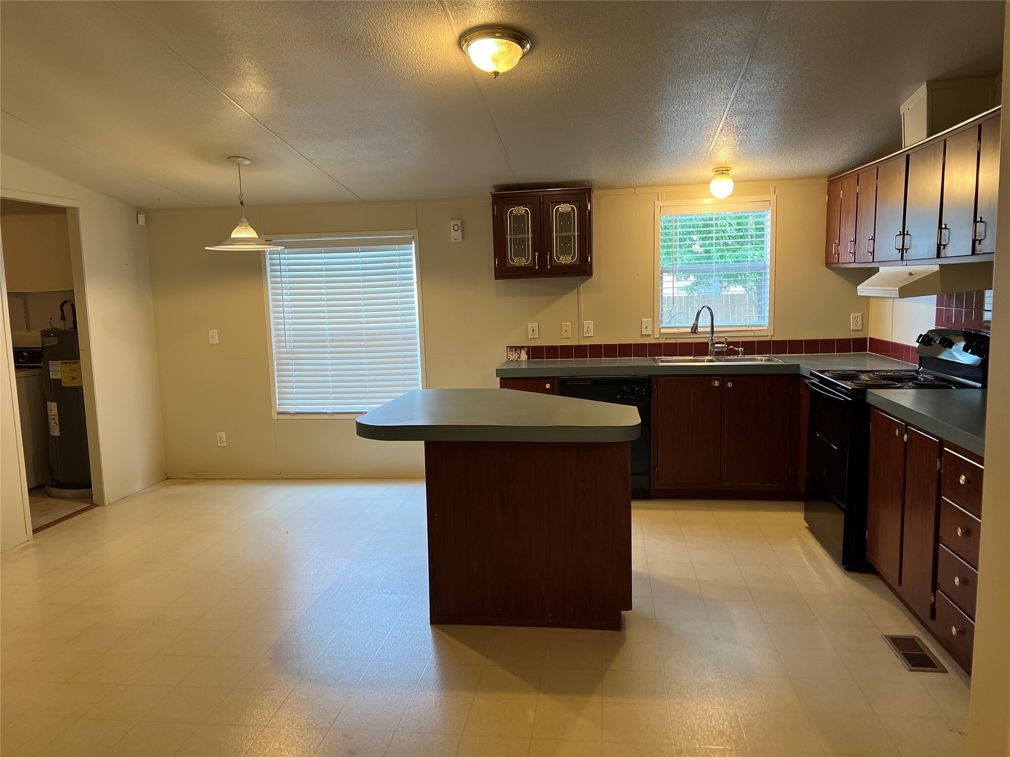 20431 Mountaindale Drive Cypress, TX 77433 - Photo 2 of 17 a kitchen with stainless steel appliances granite countertop a stove a sink and a refrigerator