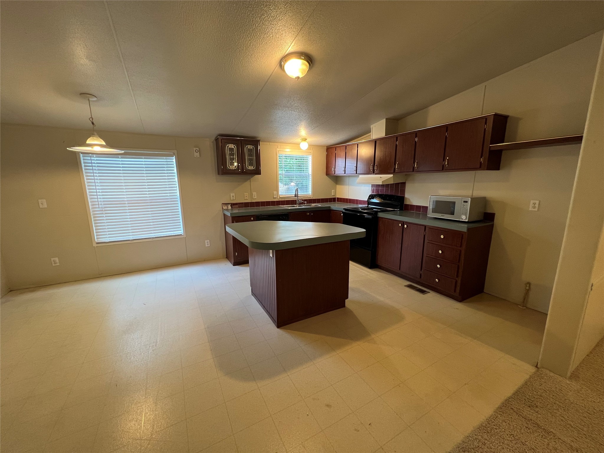 20431 Mountaindale Drive Cypress, TX 77433 - Photo 3 of 17 a kitchen with granite countertop a sink counter top space and stainless steel appliances