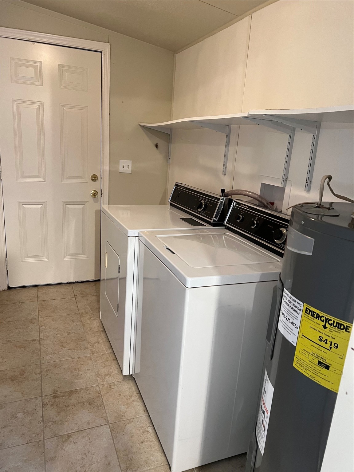 20431 Mountaindale Drive Cypress, TX 77433 - Photo 8 of 17 a utility room with dryer and washer
