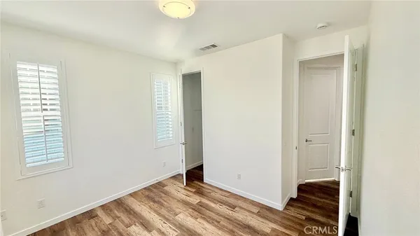 a view of hallway with livingroom and a window