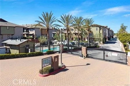 a view of multiple houses with a swimming pool