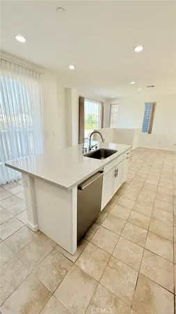 a kitchen with stainless steel appliances granite countertop a sink and a stove