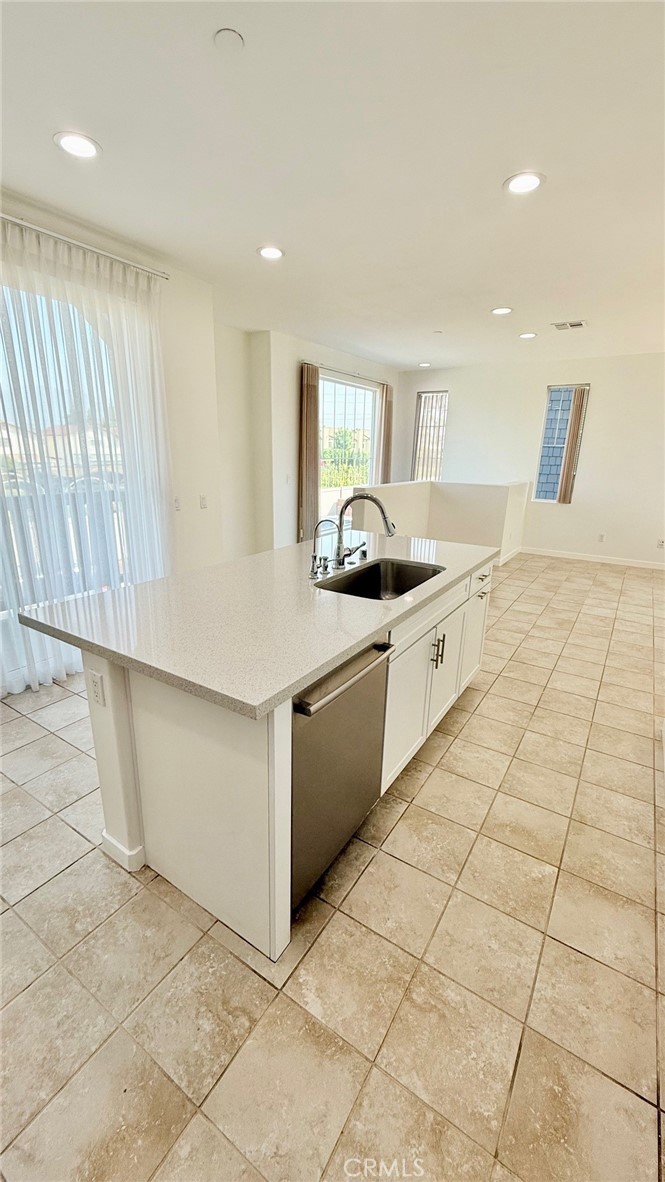 713 South Azusa Avenue, Unit A Azusa, CA 91702 - Photo 6 of 24 a kitchen with stainless steel appliances granite countertop a sink and a stove