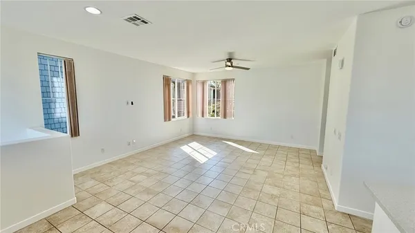 a view of empty room with windows