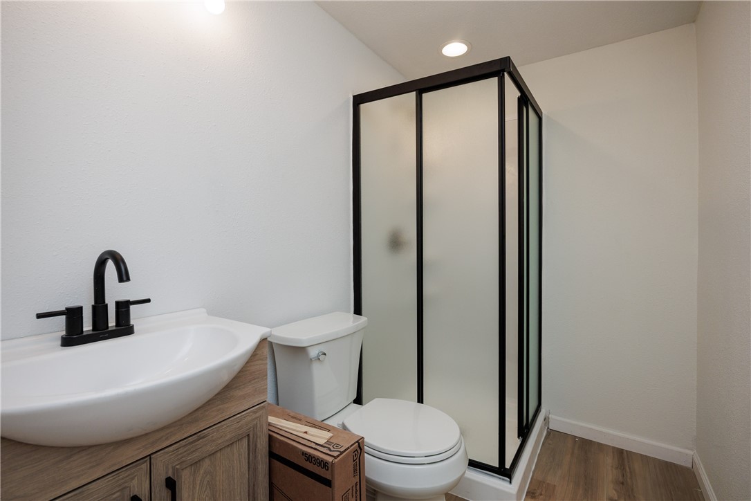 306 Allison Drive Gregory, TX 78359 - Photo 10 of 27 a bathroom with a toilet a sink and shower