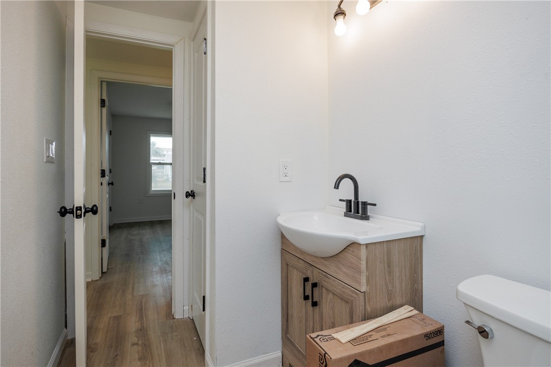 306 Allison Drive Gregory, TX 78359 - Photo 11 of 27 a bathroom with a sink toilet and shower