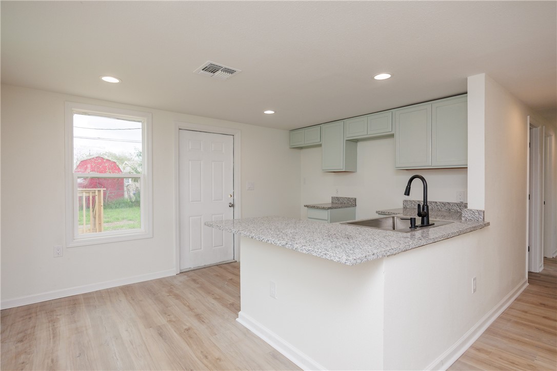 306 Allison Drive Gregory, TX 78359 - Photo 7 of 27 a kitchen with a sink and a window