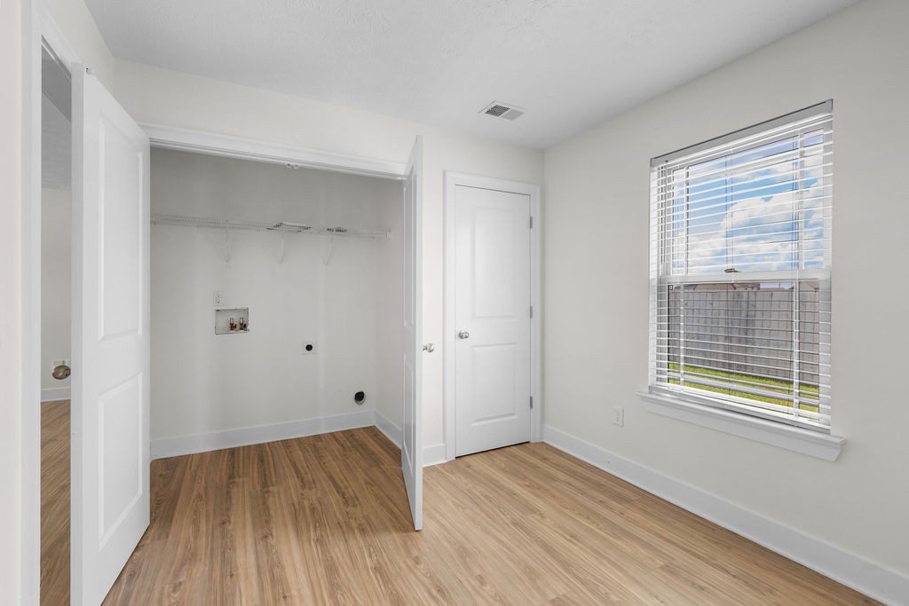 408 Brigade Court Lebanon, TN 37087 - Photo 15 of 36 a view of empty room with wooden floor and fan