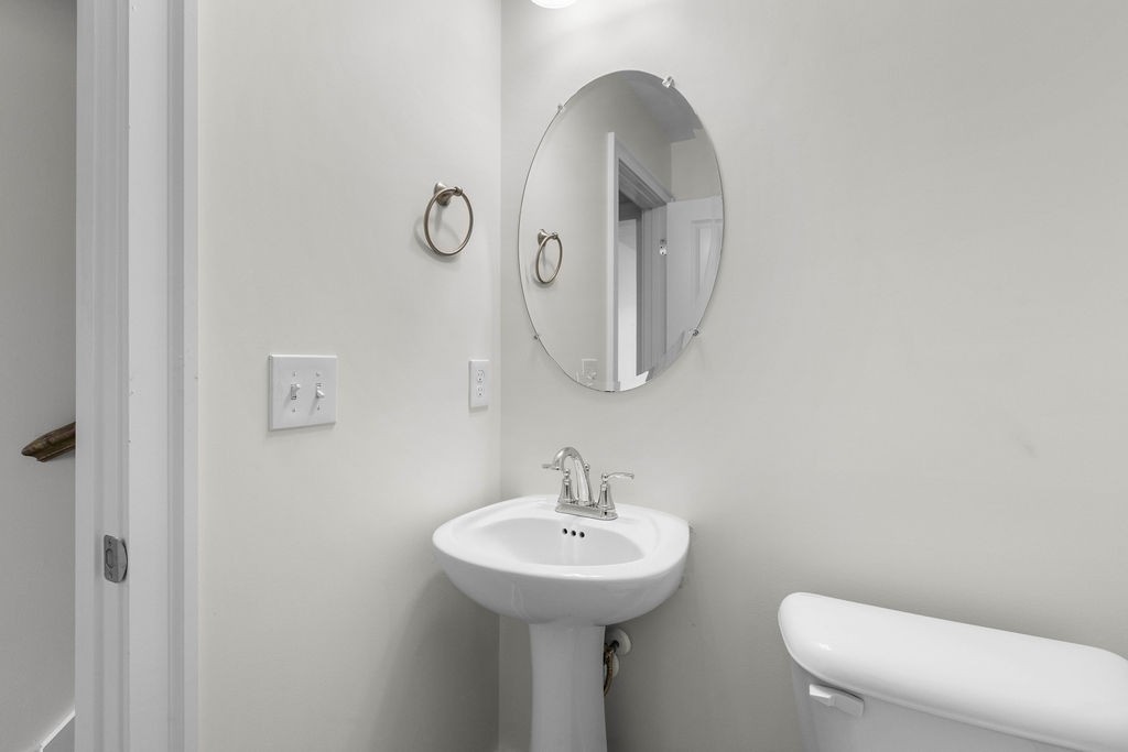 408 Brigade Court Lebanon, TN 37087 - Photo 18 of 36 a bathroom with a toilet sink and mirror