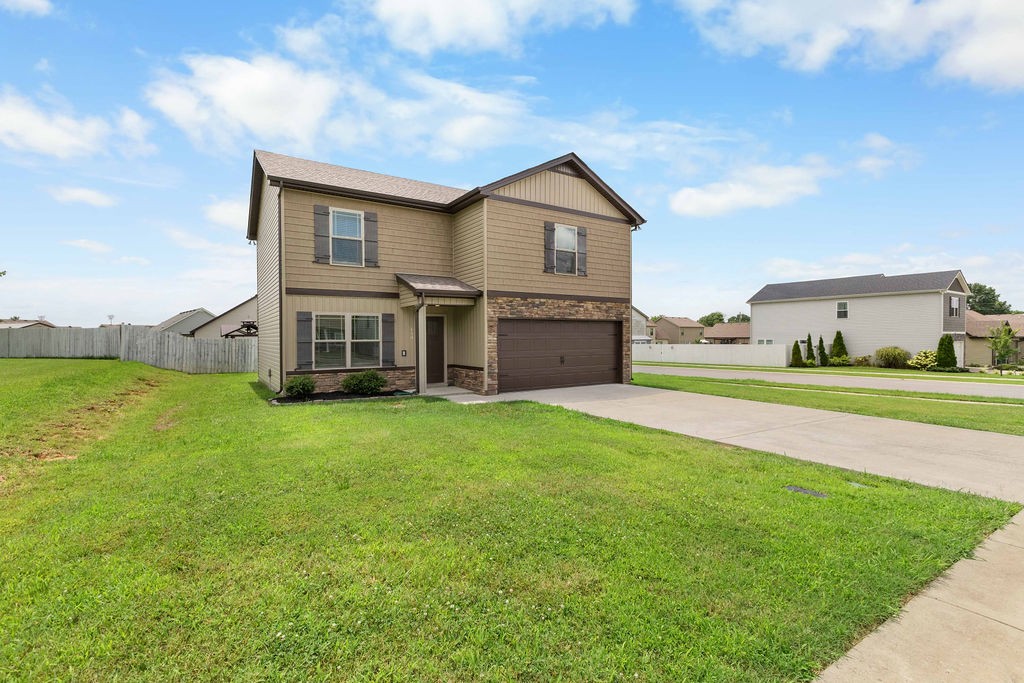 408 Brigade Court Lebanon, TN 37087 - Photo 36 of 36 a front view of a house with a garden and yard