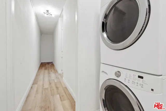 a view of a hallway with washer and dryer