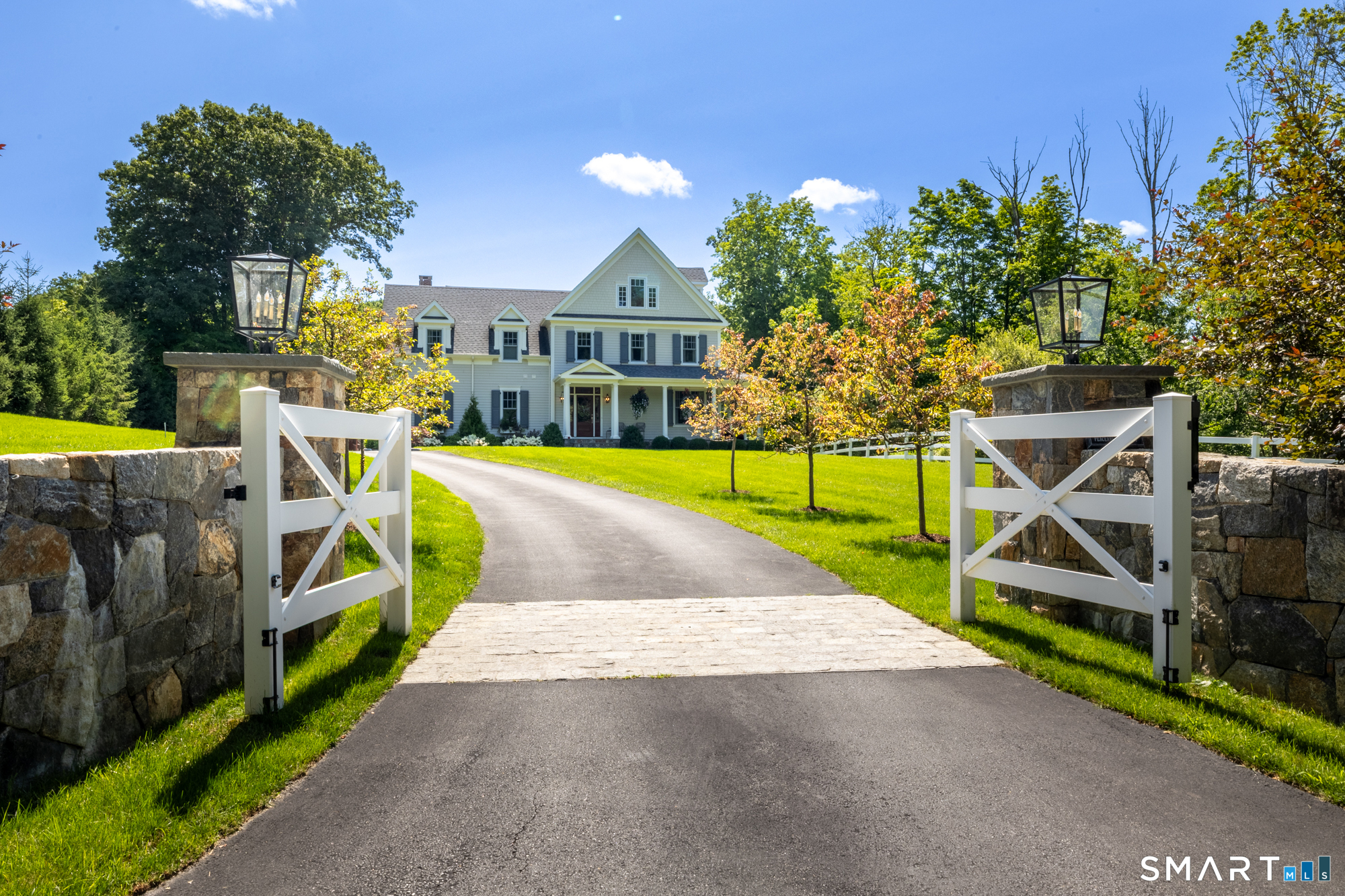 263 Peaceable Street Ridgefield, CT 06877 - Photo 35 of 40 Main entryway with classic post & rail fencing