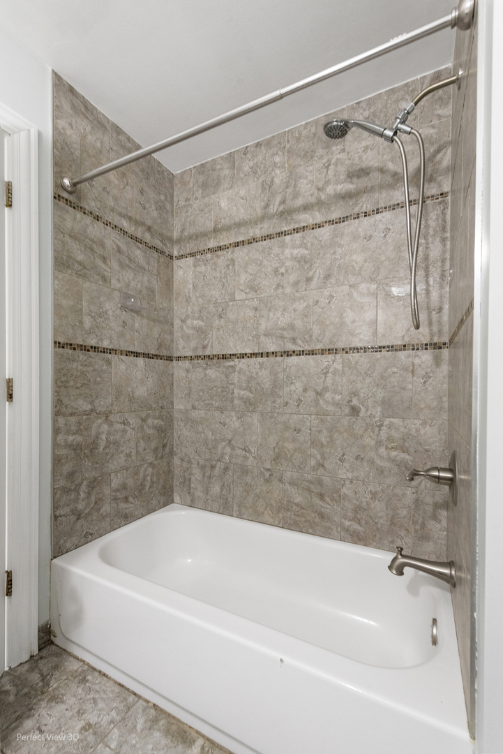 217 Oriole Road Matteson, IL 60443 - Photo 17 of 22 a bathroom with a shower and a bath tub