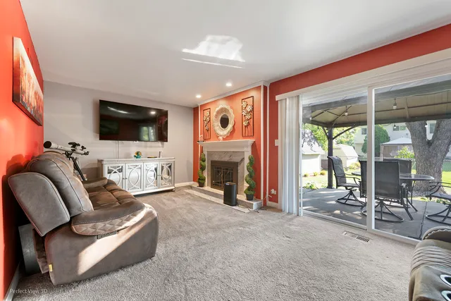 a view of a livingroom with furniture and a flat screen tv