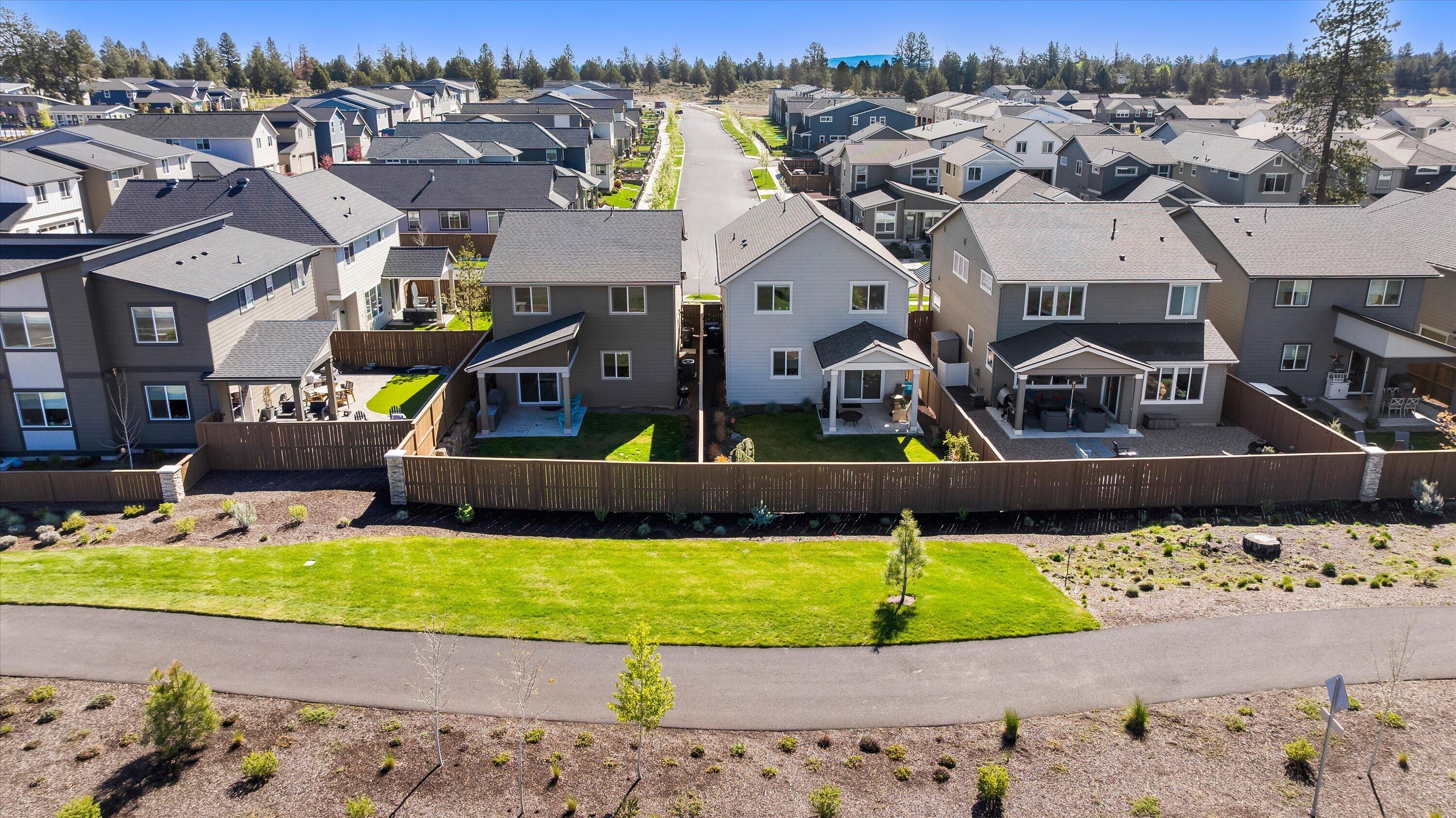 60903 Southeast Epic Place Bend, OR 97702 - Photo 3 of 48 a view of a house with a big yard and sitting area