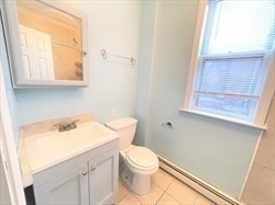 5 Saybrook Street, Unit 1 Boston, MA 02135 - Photo 3 of 7 a bathroom with a sink a toilet and a window