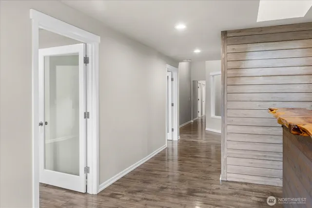 a view of hallway with wooden floor