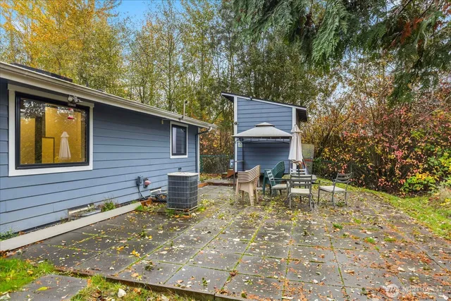 a house with trees in the background