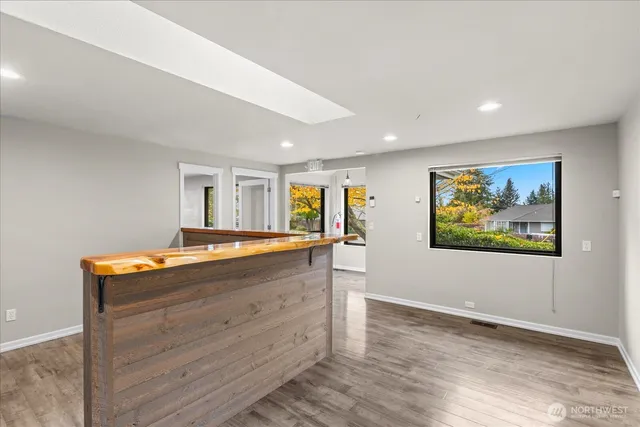 a room with wooden floor and window