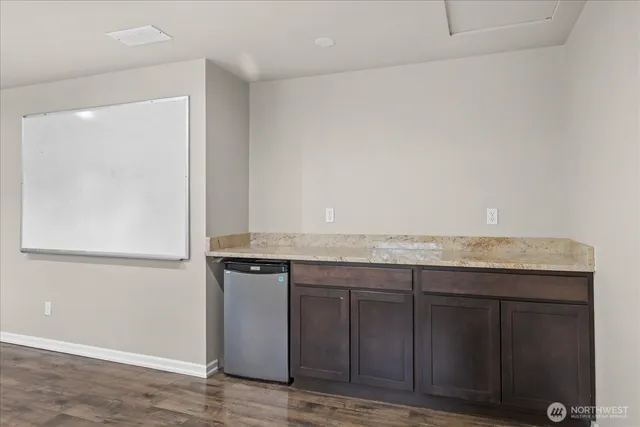 a view of cabinets with wooden floor