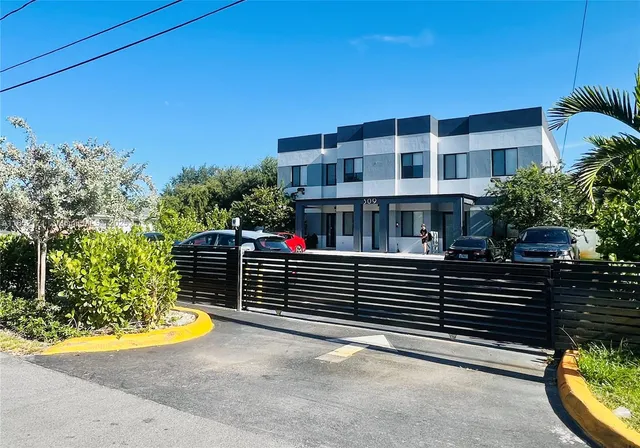 a kitchen with a sink stove and refrigerator