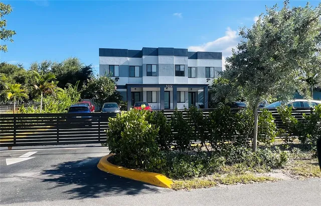 a view of a building with a garden