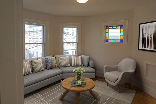 40 Calvin Street, Unit 2 Somerville, MA 02143 - Photo 3 of 12 a living room with furniture a rug and a window