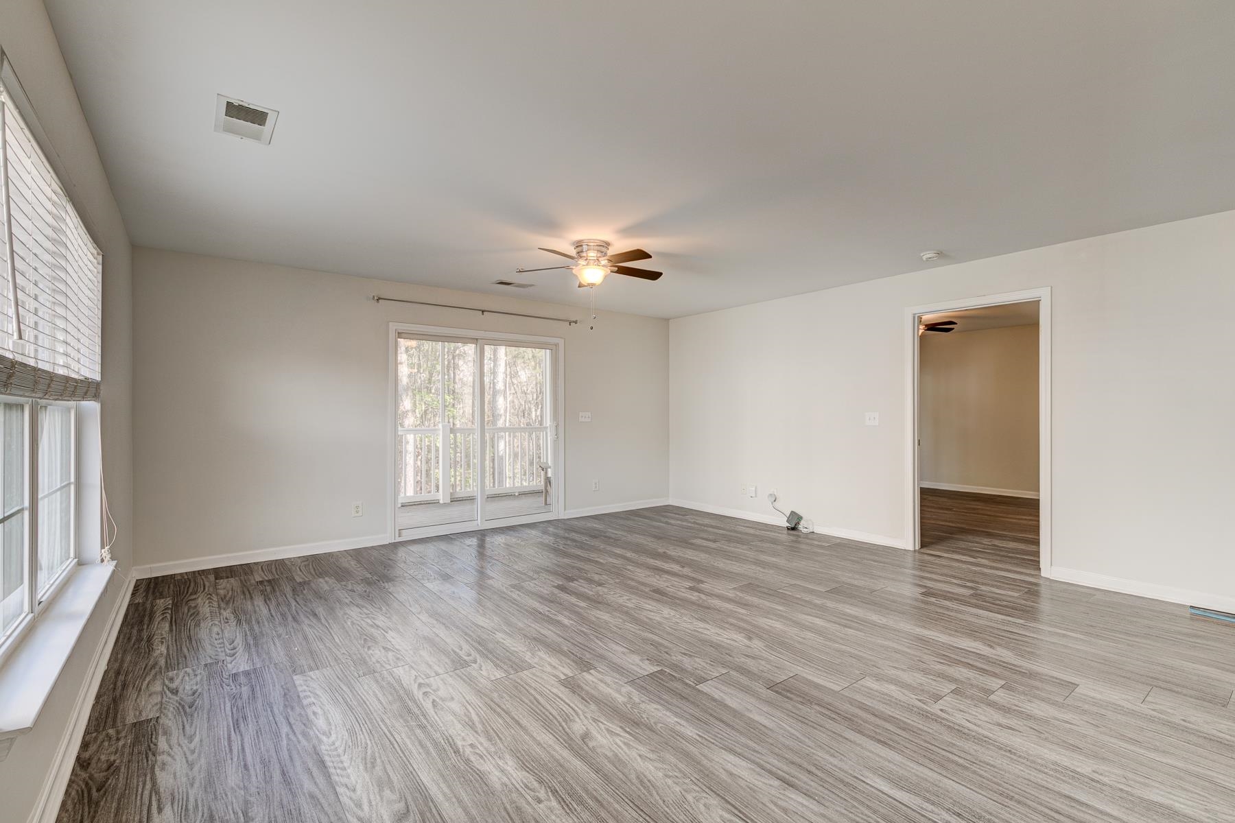 4826 Innisbrook Court, Unit 905 Myrtle Beach, SC 29579 - Photo 13 of 36 Unfurnished room with light wood-style floors and ceiling fan