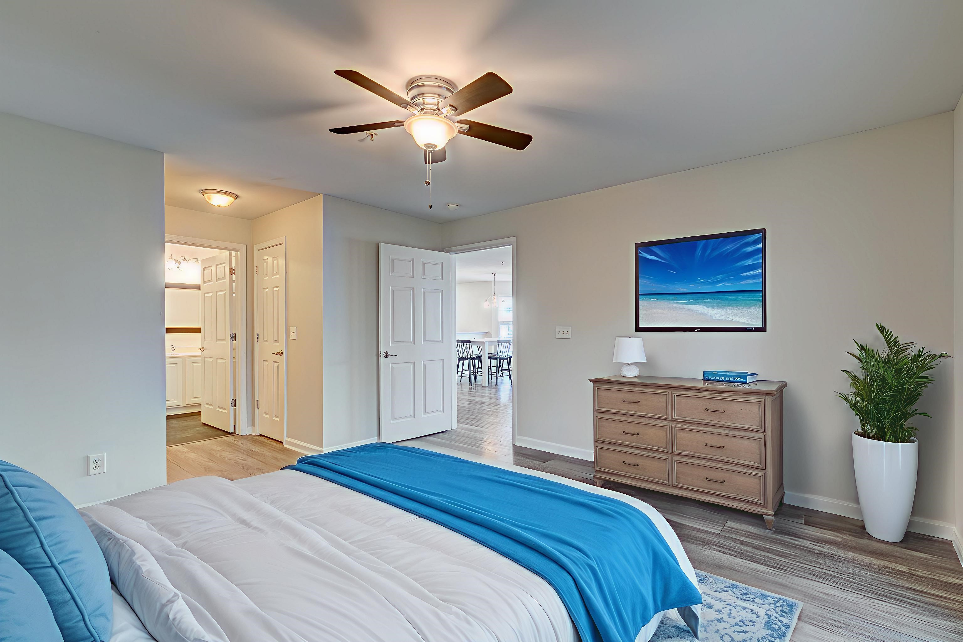 4826 Innisbrook Court, Unit 905 Myrtle Beach, SC 29579 - Photo 15 of 36 Bedroom featuring light wood-style floors, ceiling fan, and connected bathroom
