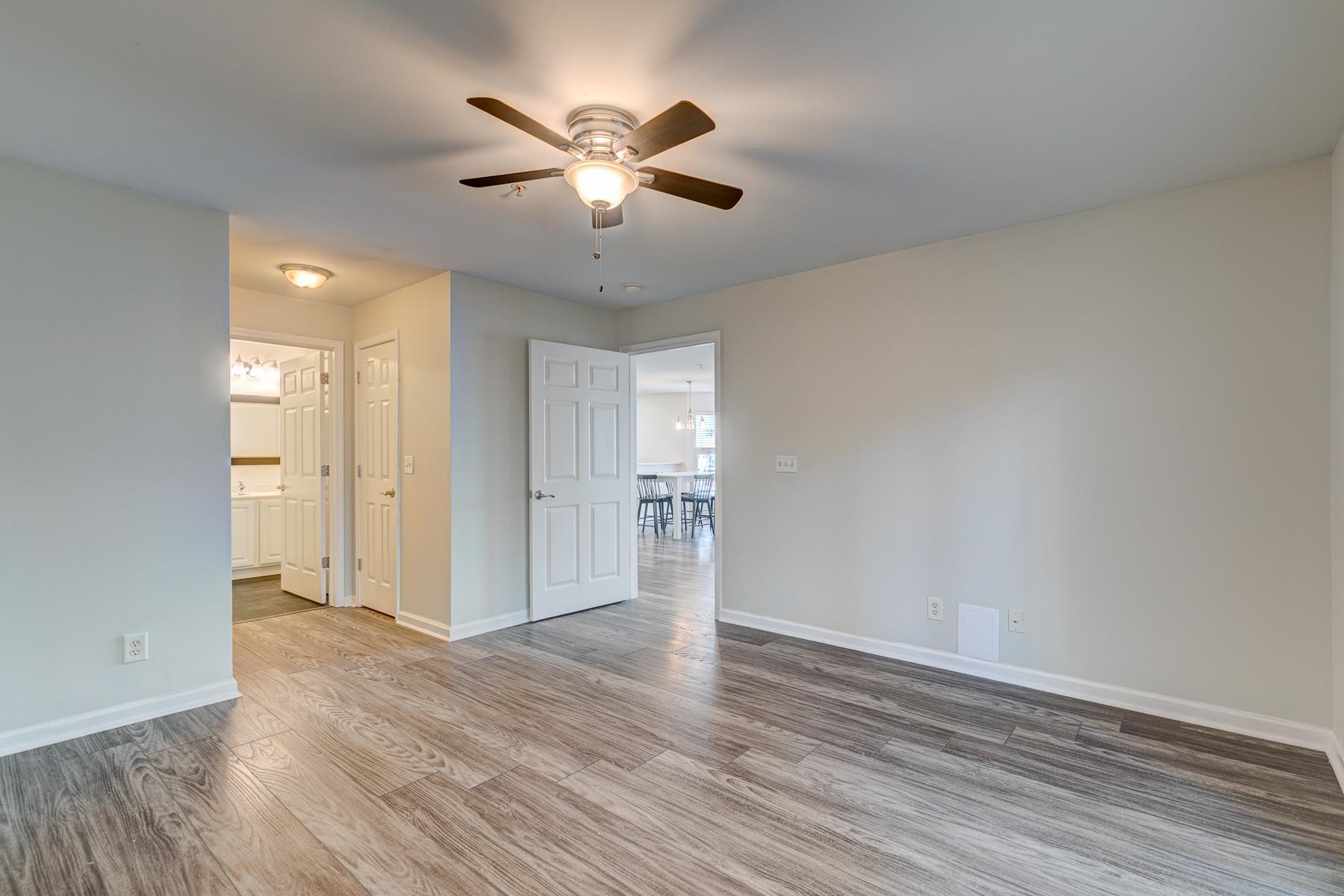 4826 Innisbrook Court, Unit 905 Myrtle Beach, SC 29579 - Photo 16 of 36 Unfurnished room featuring wood finished floors and ceiling fan