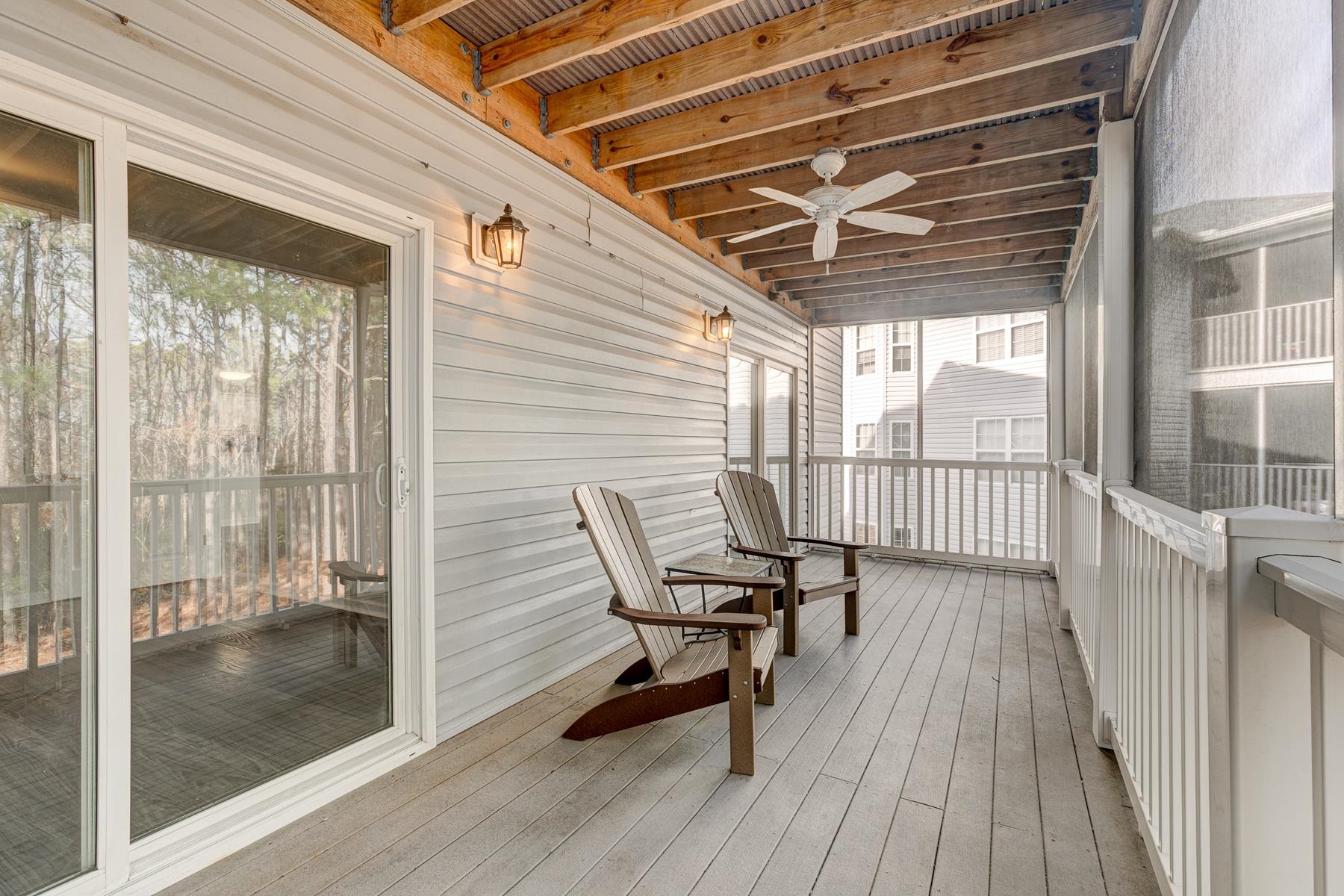 4826 Innisbrook Court, Unit 905 Myrtle Beach, SC 29579 - Photo 17 of 36 Wooden deck featuring a sunroom and a ceiling fan