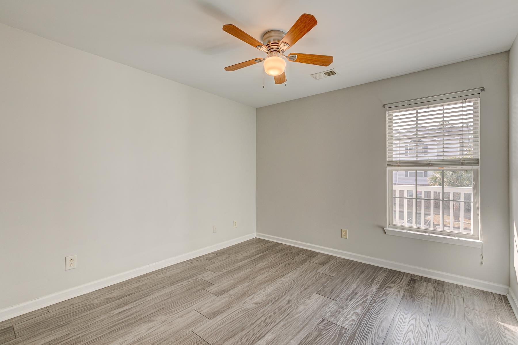 4826 Innisbrook Court, Unit 905 Myrtle Beach, SC 29579 - Photo 22 of 36 Unfurnished room with light wood-type flooring and a ceiling fan