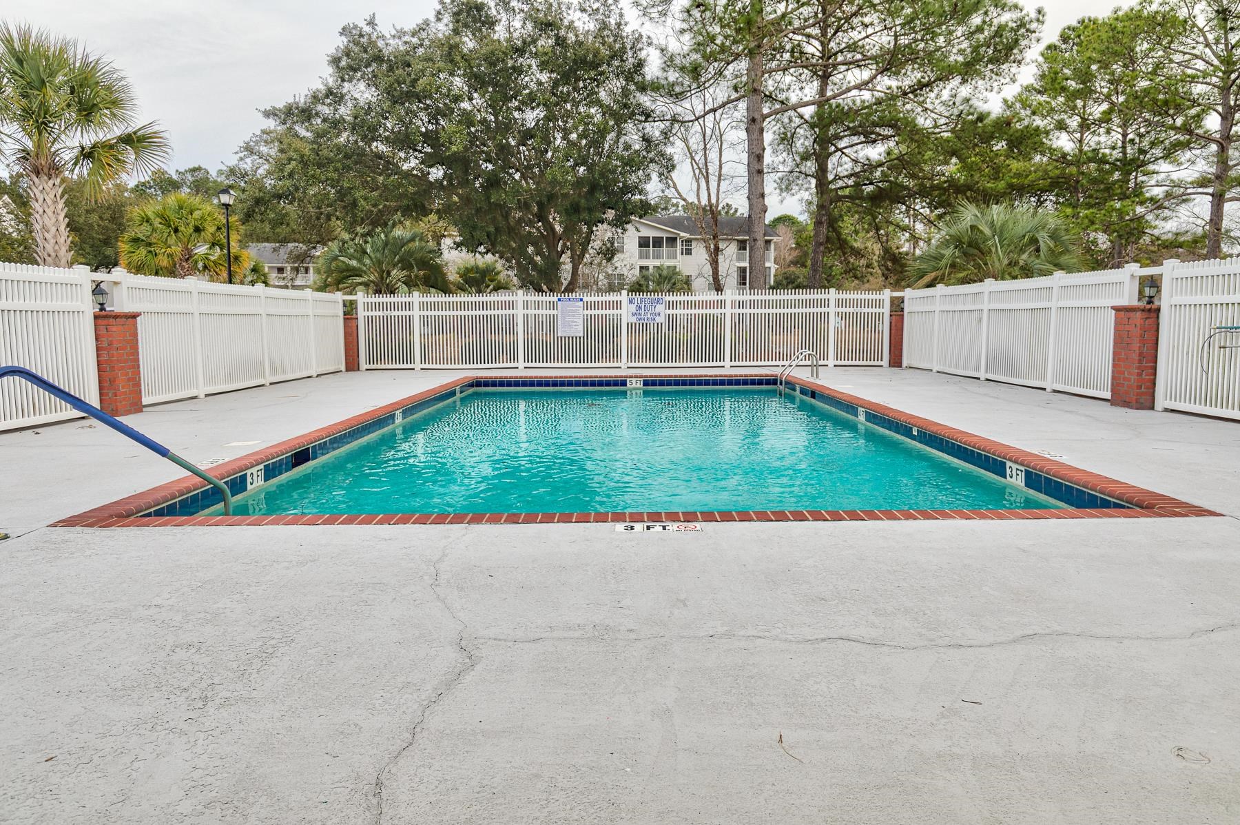 4826 Innisbrook Court, Unit 905 Myrtle Beach, SC 29579 - Photo 34 of 36 Community pool with a fenced backyard and a patio